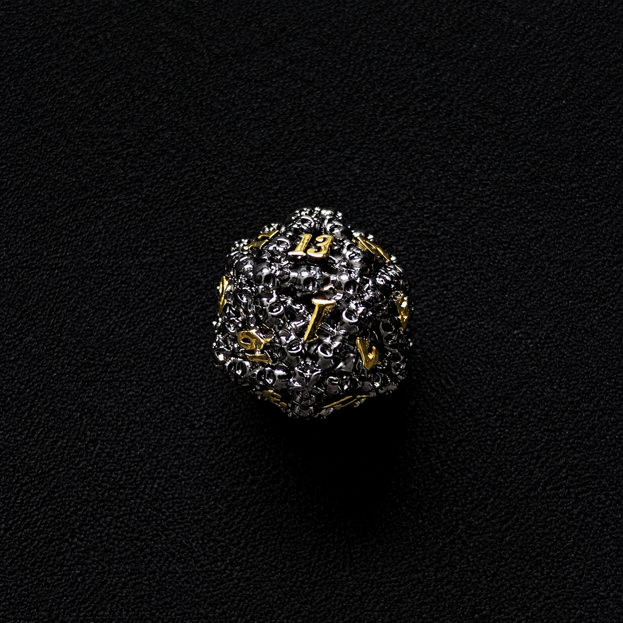 The Ossuary Set — Hollow Skull Metal Dice, Black & Gold
